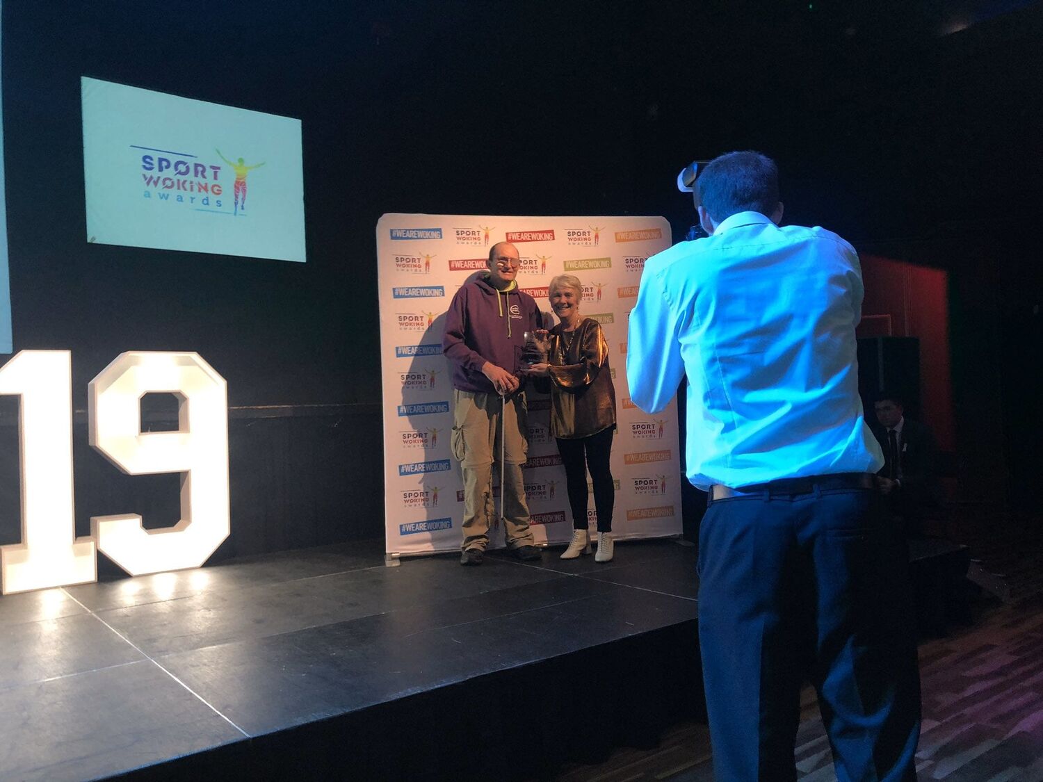 Michael receiving award