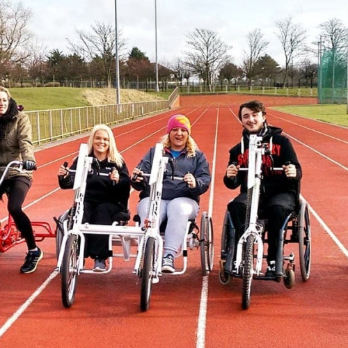 People riding adapted bikes at Blackpool Wheels for All