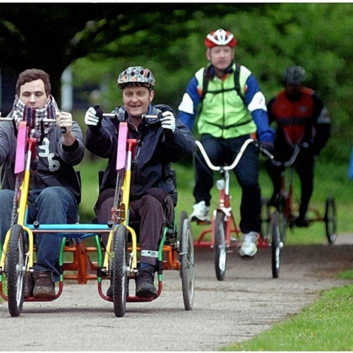 People riding adapted bikes